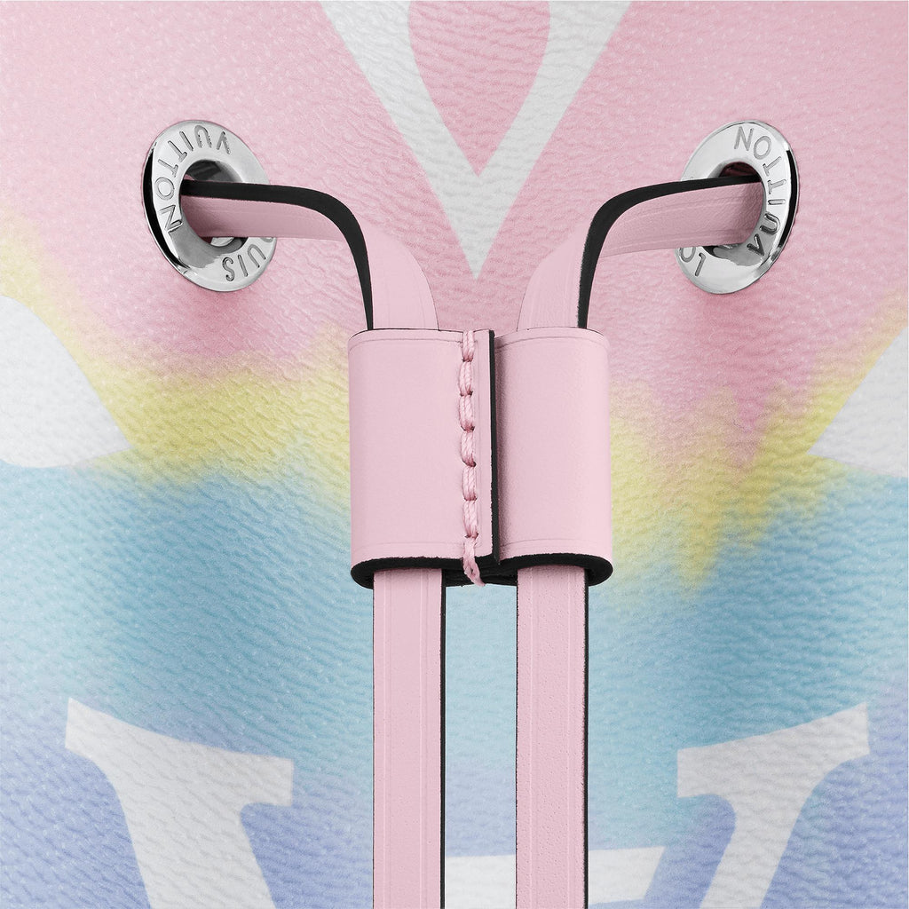 Pink earbuds with a branded case on a colorful background