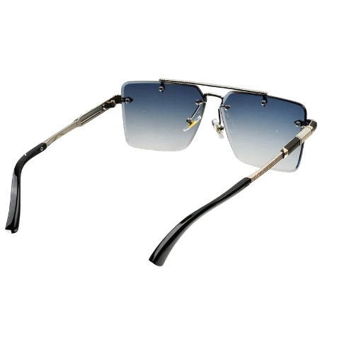Sunglasses with black and gold frame and gradient lenses on a white background