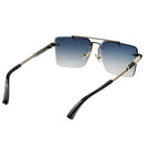 Sunglasses with black and gold frame and gradient lenses on a white background