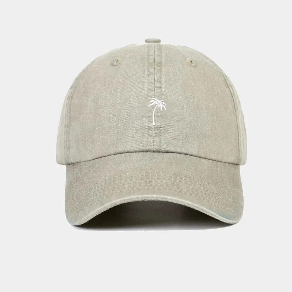 Beige cap with a palm tree logo on a white background