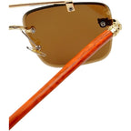 Sunglasses with gold frame and brown lenses on a white background