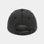 Black baseball cap on a light gray background