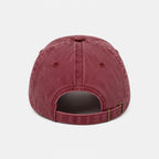 Maroon baseball cap on a light gray background