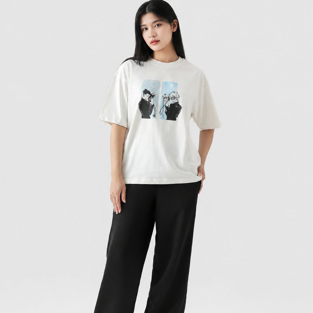 Person wearing a white t-shirt with a graphic design and black pants on a white background