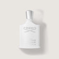 Creed eau de toilette bottle on a light gray background