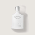 Creed eau de toilette bottle on a light gray background