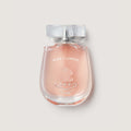 Perfume bottle labeled 'Wind Flowers' by Creed on a light gray background