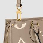 Louis Vuitton OnTheGo East West Dove Cream Monogram Empreinte Leather M23641
