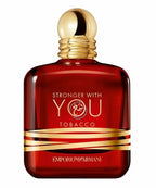 Red perfume bottle with gold cap and 'Emporio Armani' branding on a white background