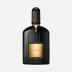 Black and gold Tom Ford perfume bottle on a light gray background
