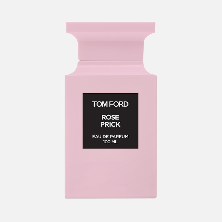 Pink Tom Ford perfume bottle with black label on a white background