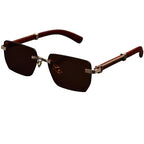 Sunglasses with brown lenses and gold frames on a white background