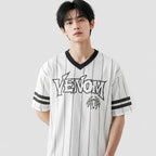 Person wearing a white sports jersey with 'Venom' branding on a light gray background