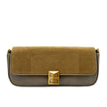 Two-tone handbag with gold clasp on a white background