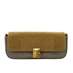 Two-tone handbag with gold clasp on a white background