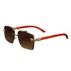 Sunglasses with wooden frame and gold accents on a white background