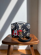 Louis Vuitton LV Crafty Pochette Metis Black Embossed Leather M45385