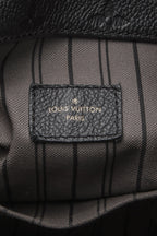 A view of the bag’s sturdy base, showing the protective metal feet.