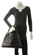 The bag in motion, showing its natural drape and slouchy shape