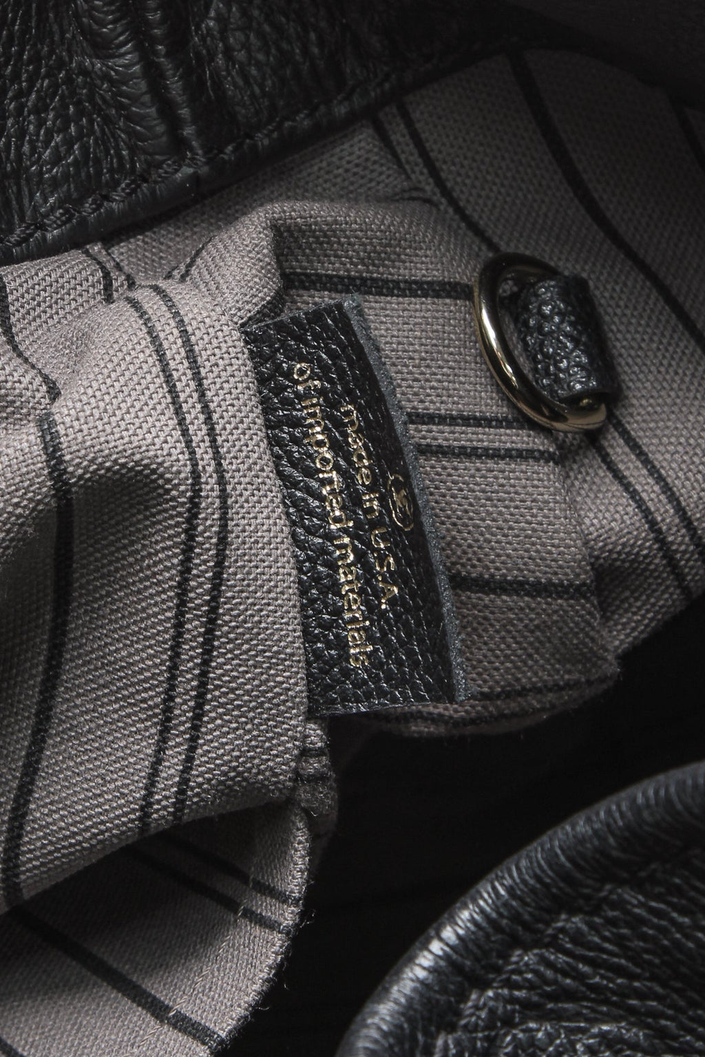 The spacious interior, showing the flat zipped pocket and double pocket