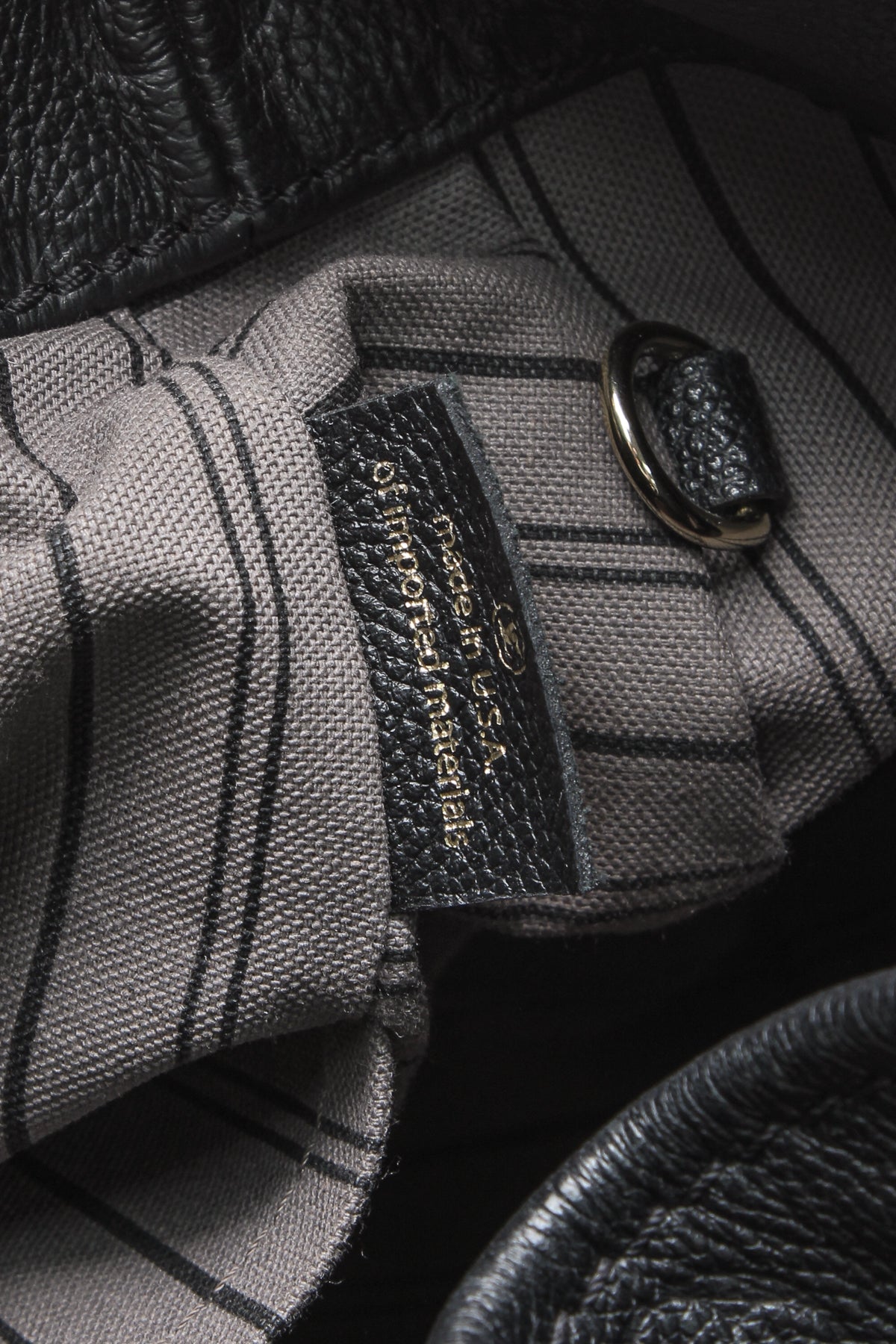The spacious interior, showing the flat zipped pocket and double pocket