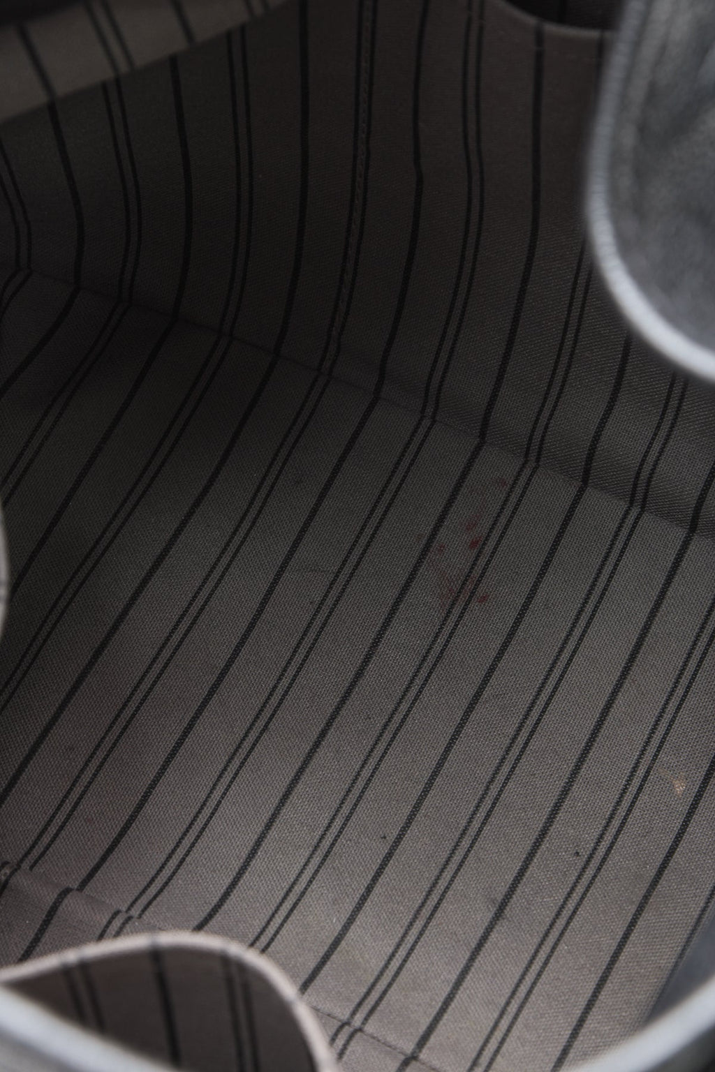 The black bag placed against a neutral background