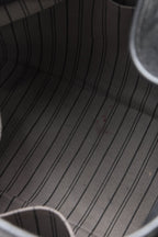 The black bag placed against a neutral background