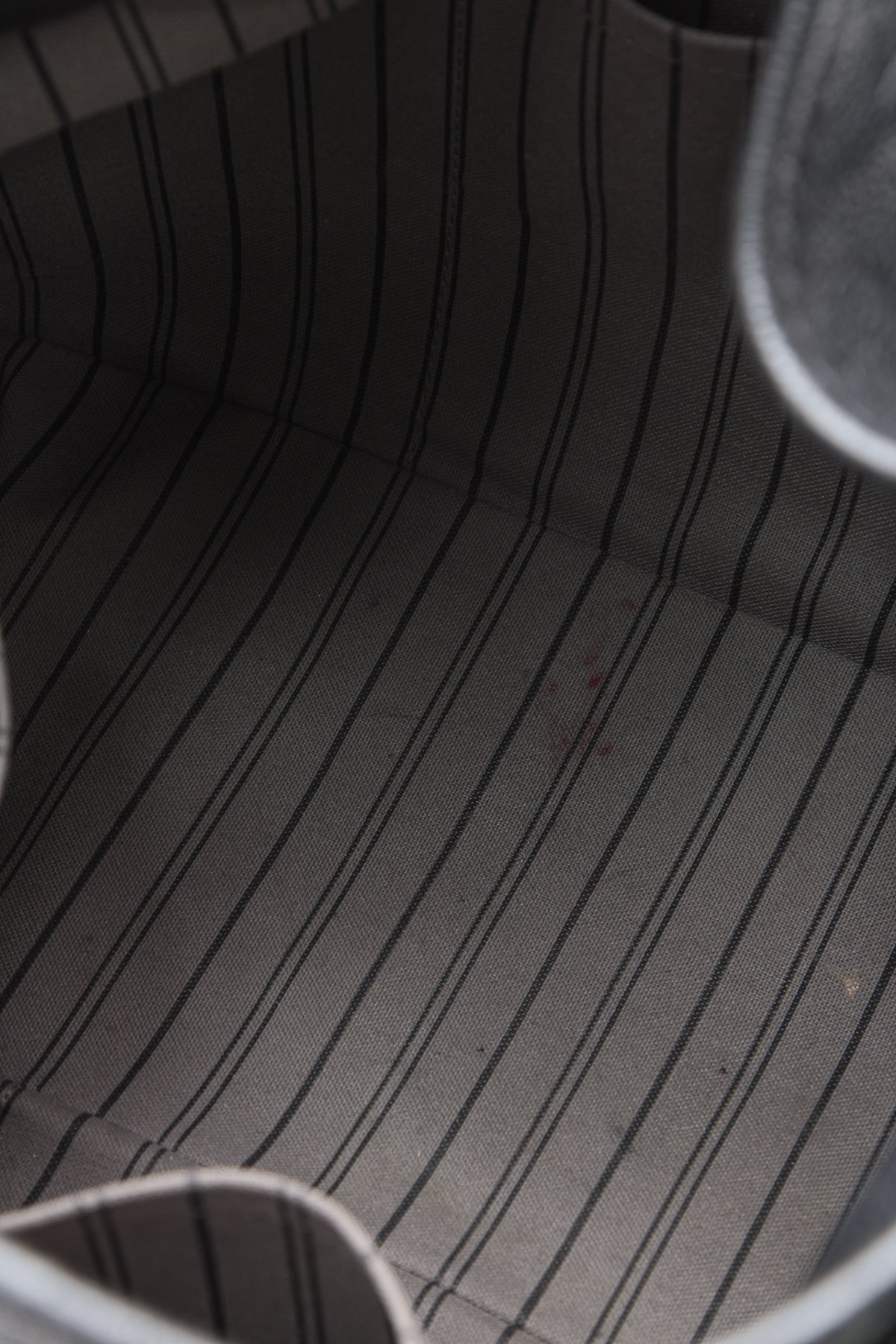 The black bag placed against a neutral background