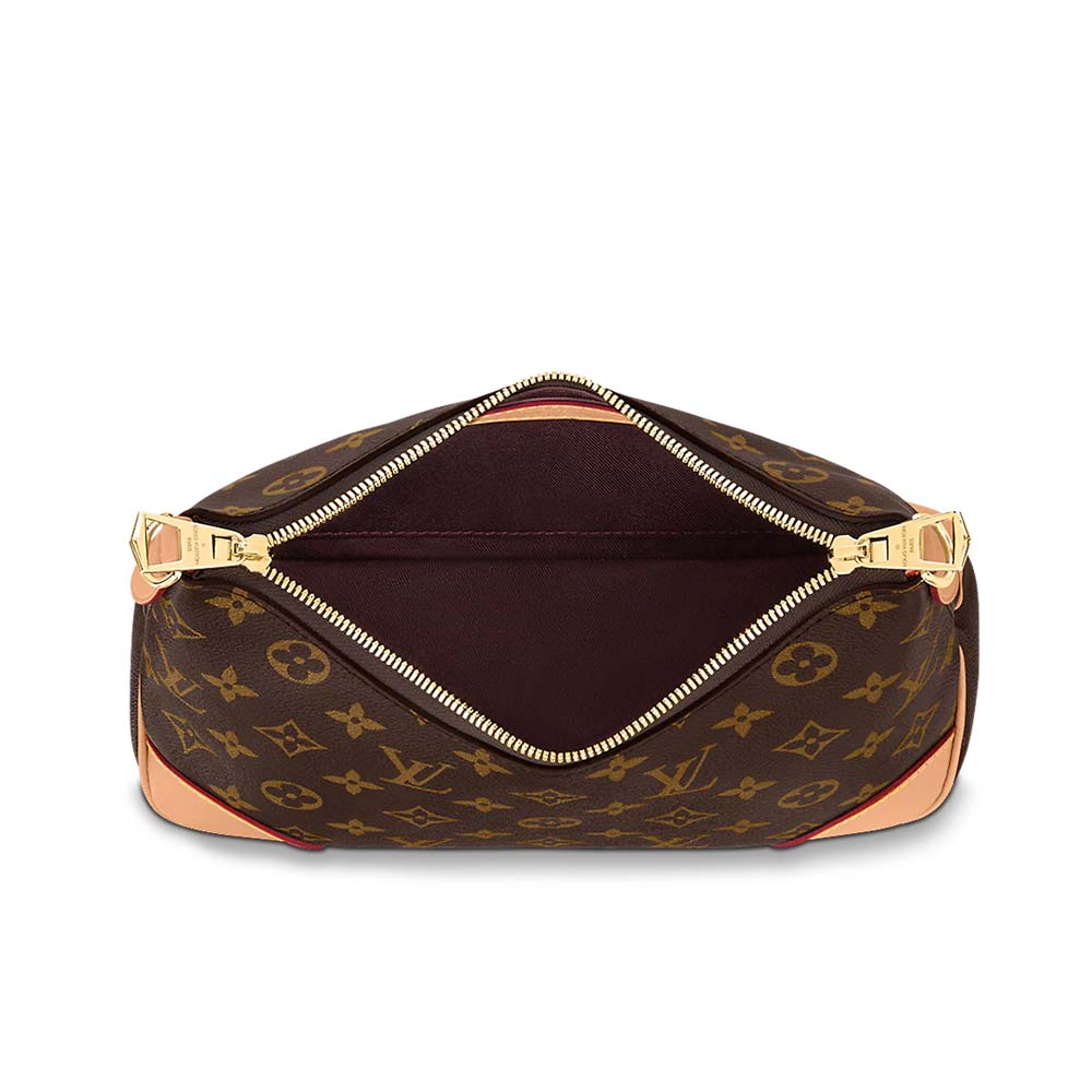 The bag carried by its chain, styled for evening