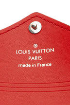 A view of the pochette highlighting its pink and red colors