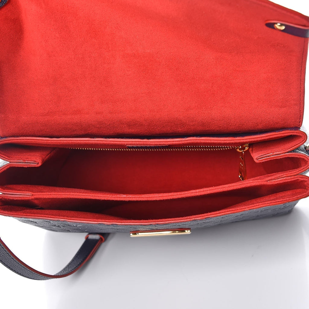 The interior of the bag, showing the red lining