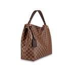 The hobo bag carried on the shoulder, showing its carry style