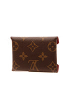 A close-up of the monogram pattern and canvas texture