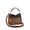 The bag being worn over the shoulder