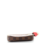 A detailed shot of the zipper and gold-tone chain with its hook