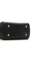 A view of the bag's base, showing the protective metal studs