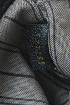 A close-up of the braided top loops for carrying the bag