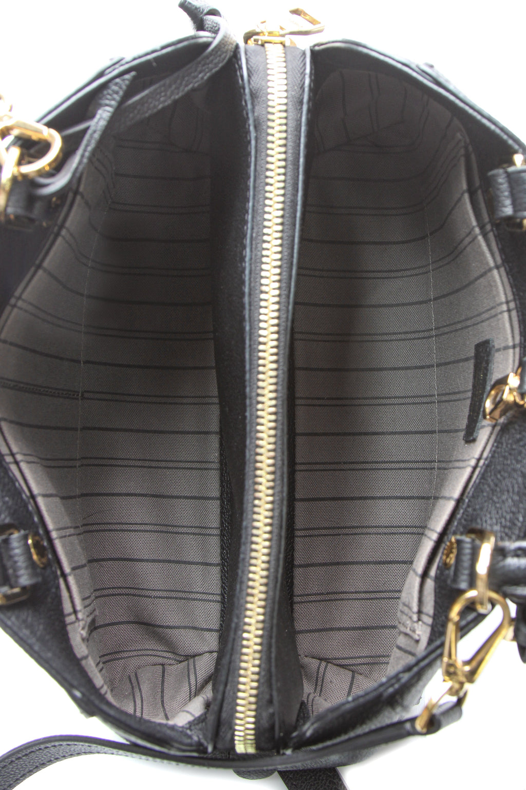 A close-up of the Monogram Empreinte leather pattern.