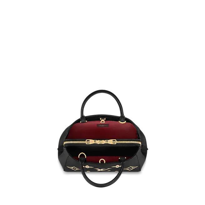 The bag is carried on the arm, showing its elegant fit