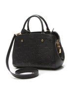 The bag shown with its removable shoulder strap attached