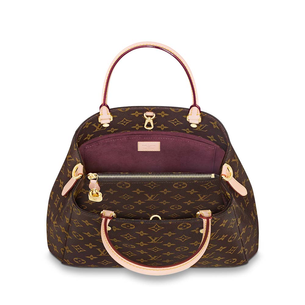 The bag shown with its removable shoulder strap attached