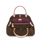 The bag shown with its removable shoulder strap attached