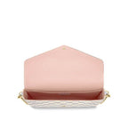 The pouch worn with its removable gold-tone chain over the shoulder