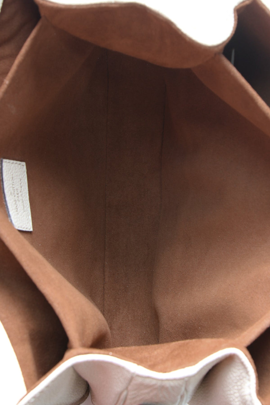 The removable crossbody strap is shown