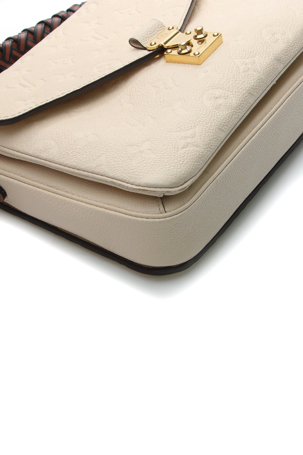 A close-up image showing the embossed Monogram pattern and leather texture