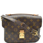 Front view of the Louis Vuitton Pochette Metis in Monogram canvas