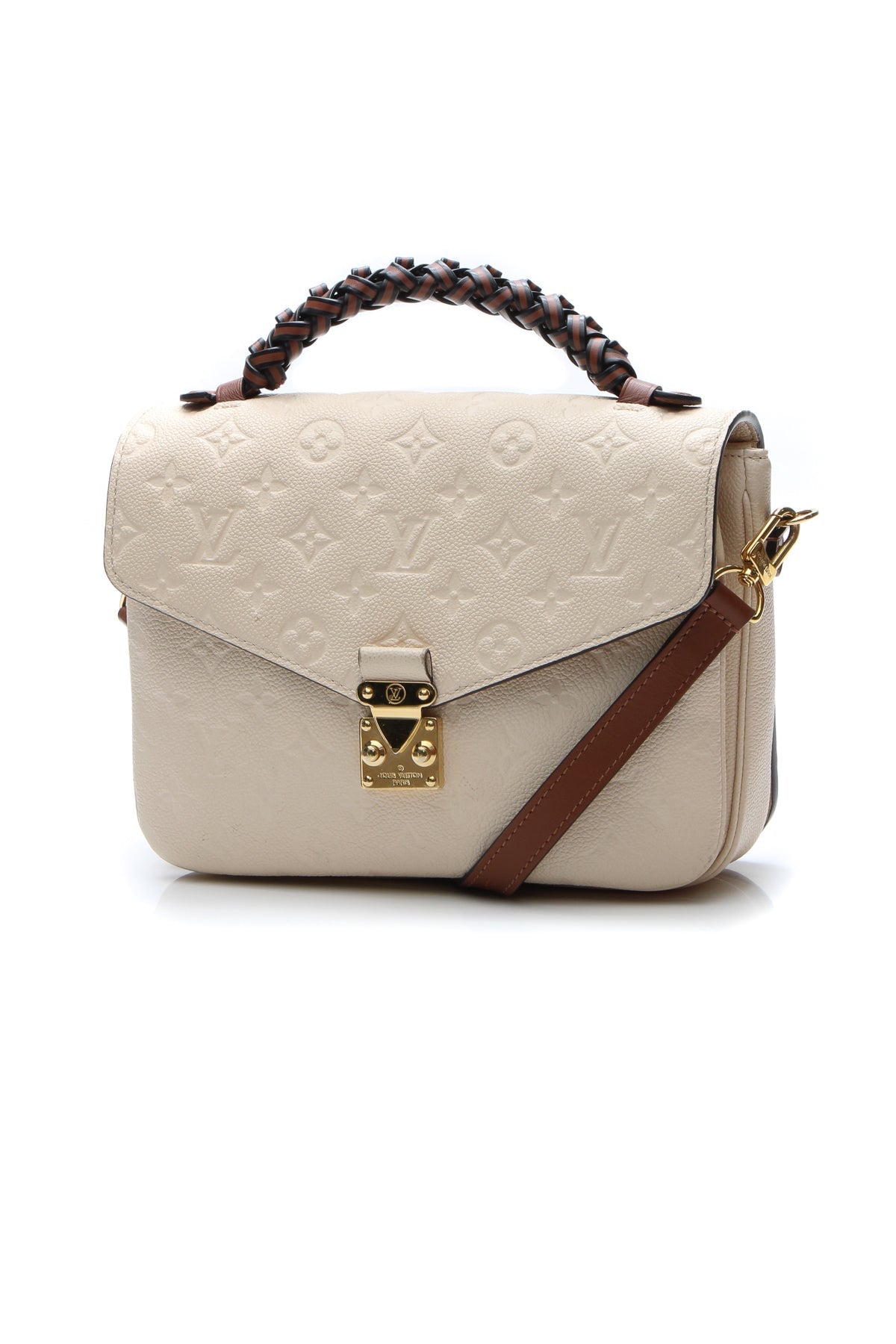 The bag carried on the forearm, highlighting its braided top handle