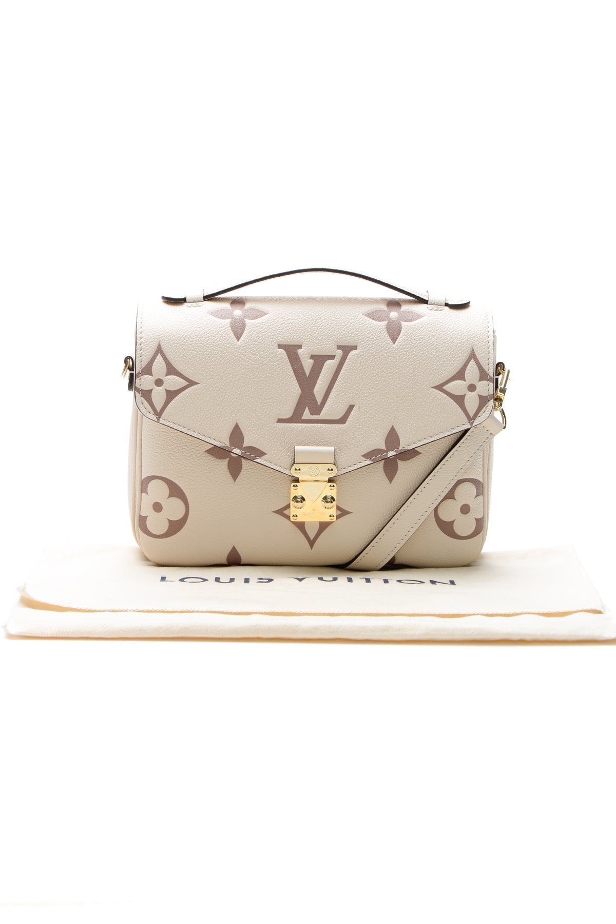 The bag carried on the forearm, highlighting its top handle carry option
