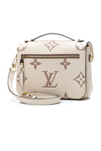 The handbag displayed upright on a flat surface