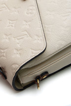 The Pochette Metis being worn over the shoulder